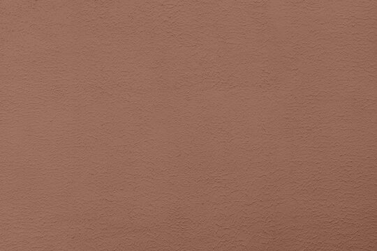 Texture of wall plaster in 2025 color mocha mousse. Introducing the Color of 2025.