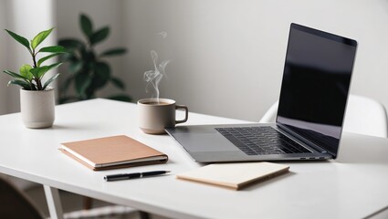 Minimalist workspace with laptop, notebook, and coffee cup