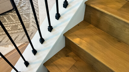 Modern Wooden Staircase with Black Iron Railing