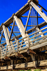 A bridge with a blue sky in the background