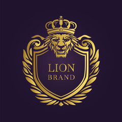 Golden lion brand logo with a crown and shield symbolizing power and luxury on a dark background  
