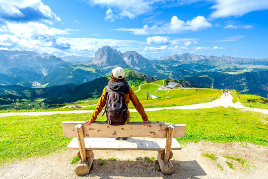 Tourist enjoying seceda mountains in the italian dolomites in summer