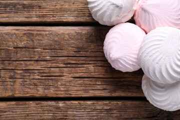 Delicious marshmallows on wooden background. Top view