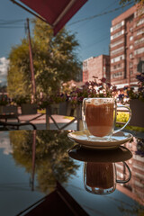 The cup of coffee early in the morning