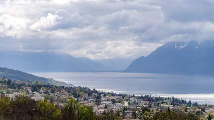 The Alps, Lake Geneva, and Lausanne on a cloudy day