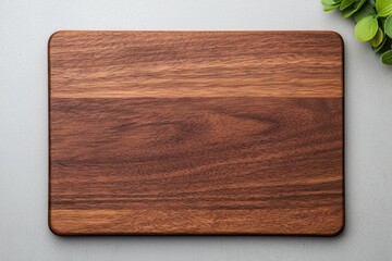 Empty wooden cutting board on gray background with rounded corners for kitchen and cooking