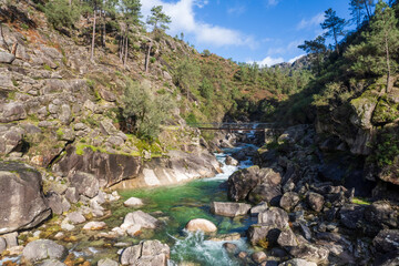 Peneda Geres National Park Portugal. Tahiti waterfalls. Scenic landscape , wild river. Its rugged hills are home to deer, wolves and golden eagles. The trails include a Roman road lined landmarks. 