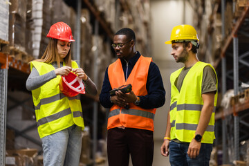 Warehouse team discussing safety procedures during inspection