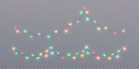 Bright garlands with multi-colored glow of bright bulbs. Christmas lights garlands bright lights glow on a transparent background. Festive chain of lights. © MAKSYM
