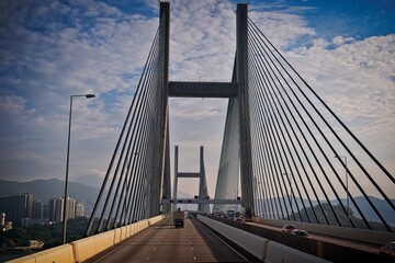 Naklejka premium Modern Cable-Stayed Bridge with Scenic Background