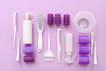 Set of hairdresser's accessories on pink background
