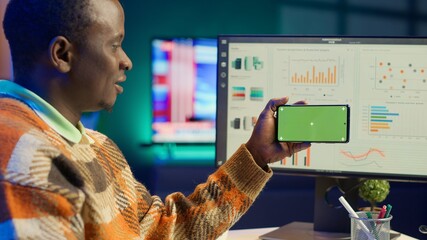 Expert analyst providing online evaluations of finances next to chroma key, solving accounting...