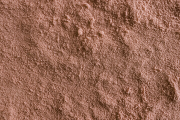 Cocoa powder surface close-up in color of the year 2025 mocha mousse