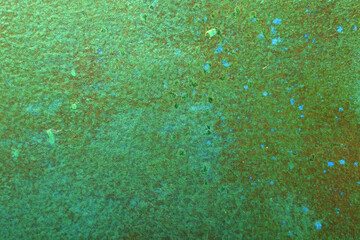 Abstract art background in bright green with blue spots