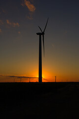 Fototapeta premium wind turbines at sunset