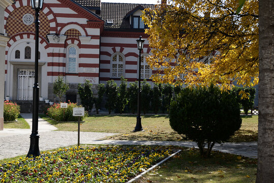 October 6, 2018 - Belgrade, Serbia. The church in the gate of the Rakovica Monastery with a part of the courtyard and the tombstones of His Holiness the Patriarch of the Serbian Gentleman Pavle 