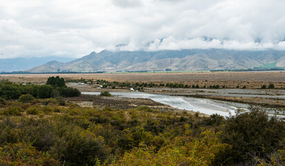 Obraz premium Beautiful new zealand mackenzie twizel landscape mountains hills clouds