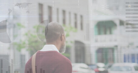 Image of diagrams and data processing over african american man walking with bicycle in city