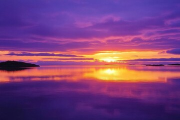 Obraz premium A serene sunset over a calm body of water, reflecting vibrant colors.