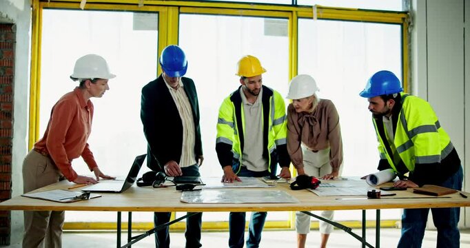 Discussion, industry and construction team on site with blueprint for building maintenance. Meeting, collaboration and group of civil engineers work on architecture project for property development.