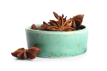 Bowl with aromatic star anise isolated on white background