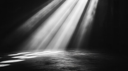 A dark background pierced by a single, central light beam