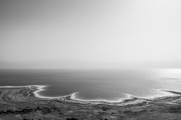 Fototapeta premium A calm, still body of water with a white horizon