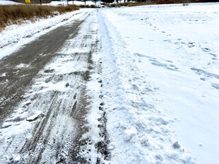 winter sidewalk cleared of snow