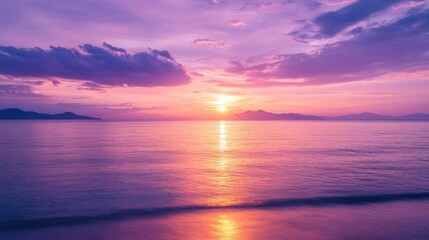 Obraz premium Serene sunset over calm ocean waters, creating a tranquil atmosphere.