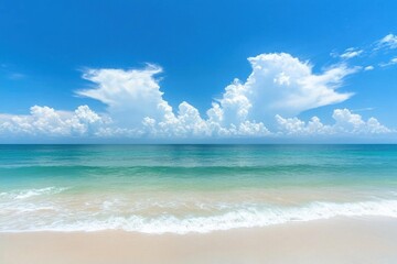 Obraz premium Serene beach scene with clear blue skies and gentle waves.