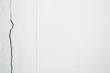 house broken. concrete crack. Water damage building interior. large crack white concrete wall