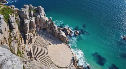 A coastal amphitheater nestled between cliffs and ocean waves.