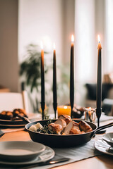 minimalist dinner table featuring candles, pan of bread, and elegant tableware creates warm and inviting atmosphere for cozy meal