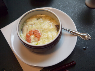 Japanese Chawanmushi creamy egg custard with shrimp in ceramic bowl 