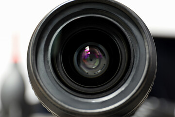Lens on the background of the process shooting, on a light background.