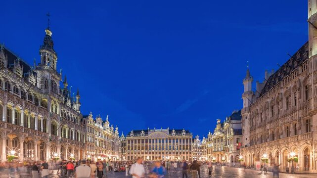 The Grand-Place (Grote Markt) day to night transition timelapse hyperlapse in Brussels, Belgium. Brabantine Gothic Town Hall, Maison Grand-Place and tourists in the historic city center after sunset