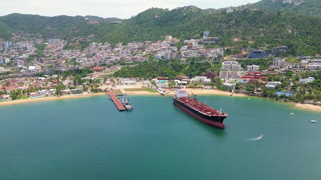 Vertical aerial video of the waves in Icacos Bay, capturing the rhythmic movement of the ocean along Acapulco's coastline