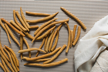 Top view of fried corn stick snack on a baking tray, Overhead view of nigerian kokoro corn snack
