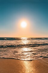 araffy view of a beach with a wave coming in to the shore