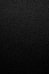 a close up of a black surface with a white background