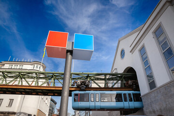 Wuppertal Schwebebahn suspension railway entering a station in Wuppertal city center, Germany. An iconic public transport system and engineering marvel.