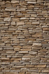 Obraz premium a close up of a stone wall with a fire hydrant in front of it