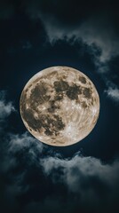 Full Moon Majestically Rises Through Night Clouds