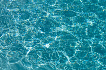 Blue ripped water in swimming pool, water pool texture and surface water backgraund.