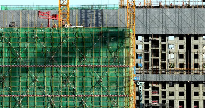 Busy Construction site Environment, workers and unfinished building