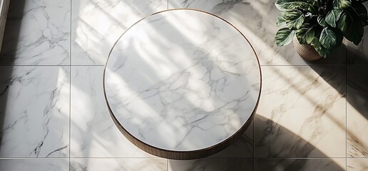 Top view of round marble table on tiled floor with sunlight.