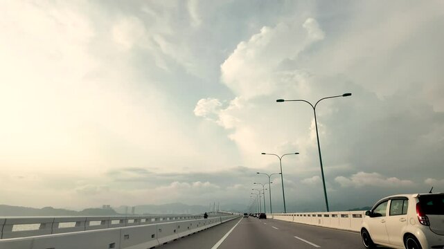 Dashboard view while driving on Penang's Second Bridge, also known as Sultan Abdul Halim Muadzam Shah Bridge..
