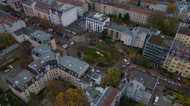 Yellow ADAC helicopter. fire in a residential building in berlin, germany, demonstrating the importance of emergency services. Fabulous aerial view flight
