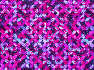 Pink, blue and purple floral background. Printed fabric with lilac flowers. Bright spring background. Colors of the fashion season