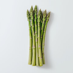 A bunch of fresh asparagus spears on a white background
